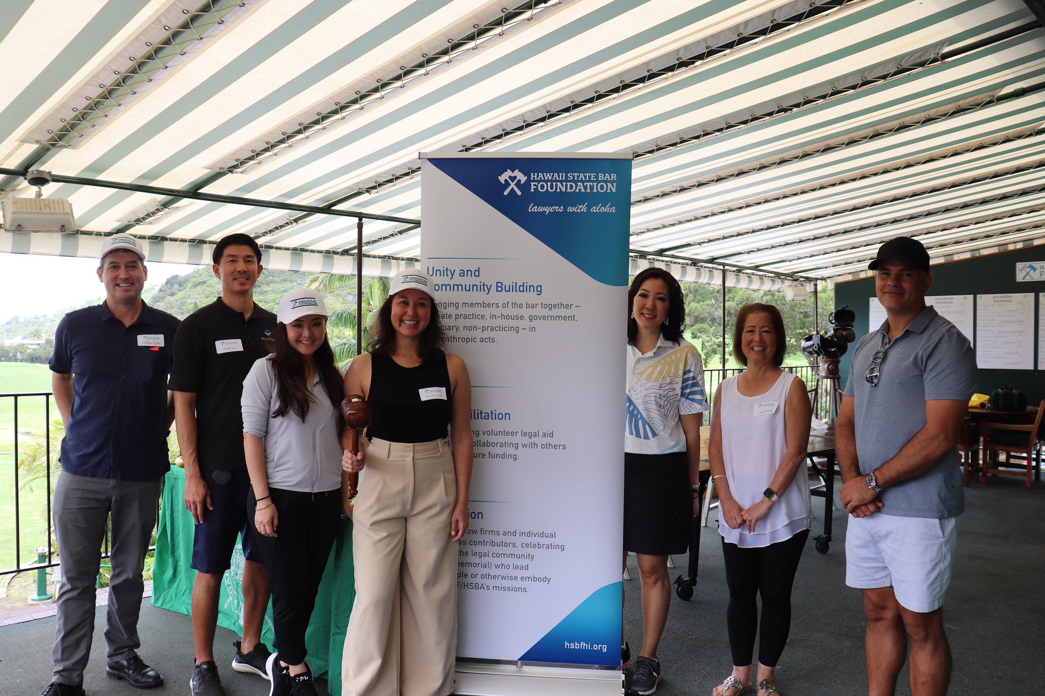 HSBA Planning Team standing in front of a HSBF Banner